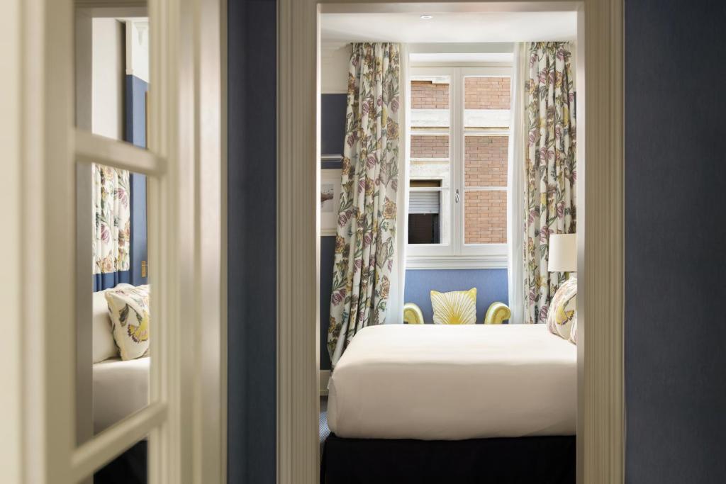 Postel nebo postele na pokoji v ubytování Maalot Roma - Small Luxury Hotels of the World