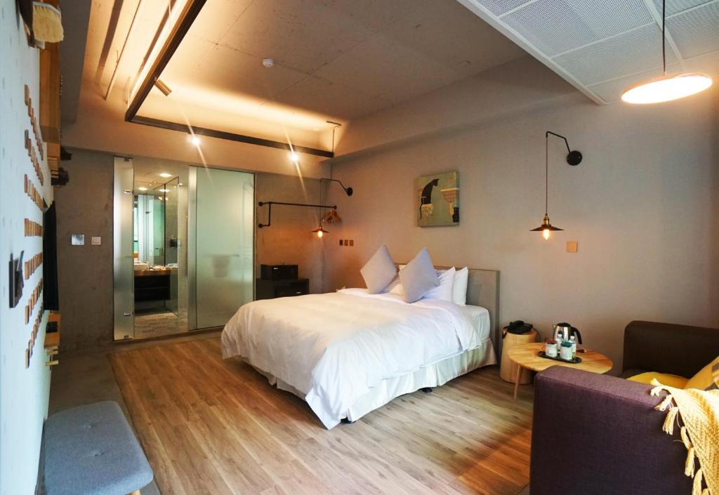 Postel nebo postele na pokoji v ubytování Thinker Hotel
