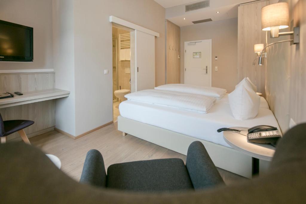 Postel nebo postele na pokoji v ubytování Hotel Sailer