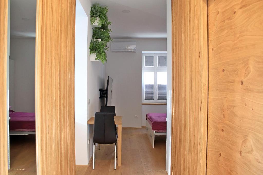Postel nebo postele na pokoji v ubytování Cirus apartments