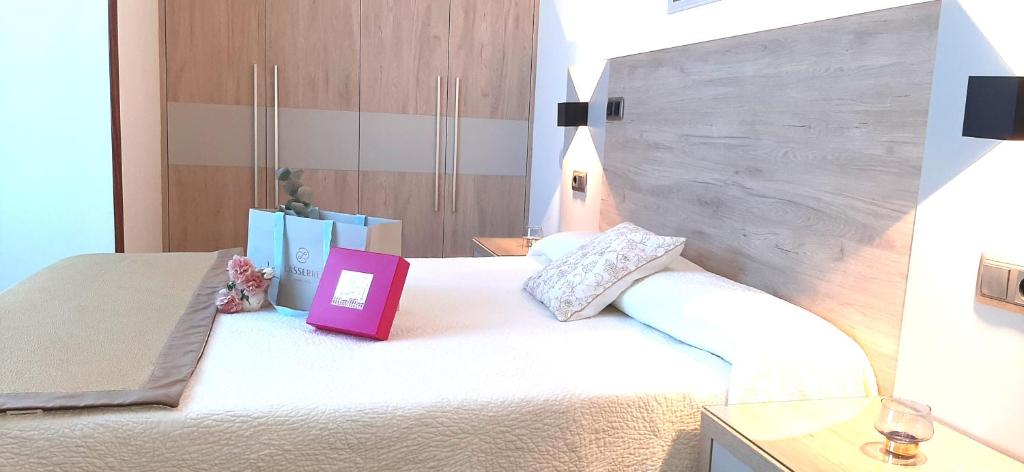 Postel nebo postele na pokoji v ubytování Hotel Nueva Plaza