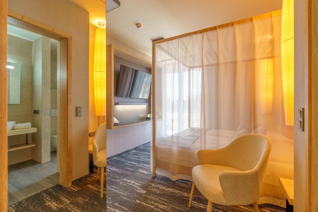 Postel nebo postele na pokoji v ubytování Hotel Hills