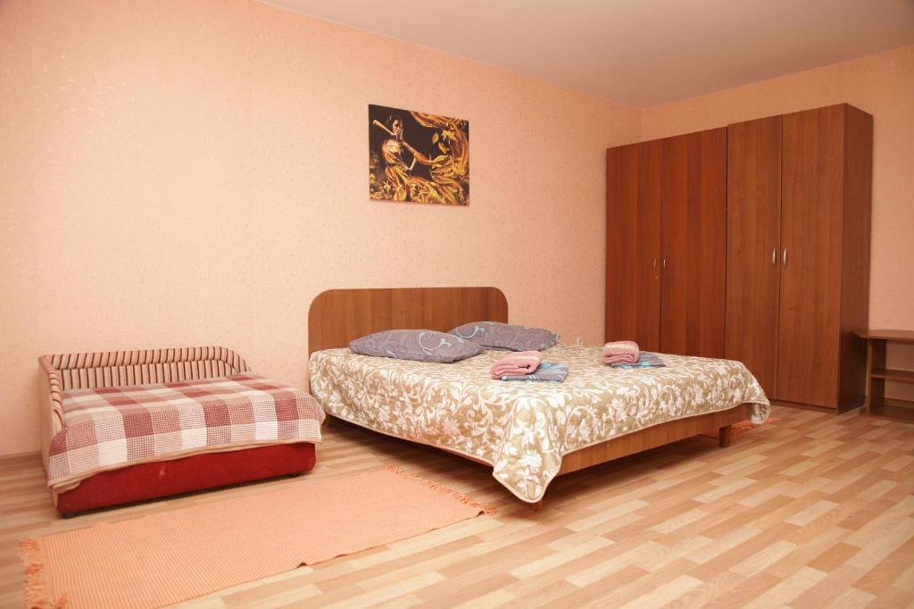 Postel nebo postele na pokoji v ubytování студия на пр.Пушкина 1
