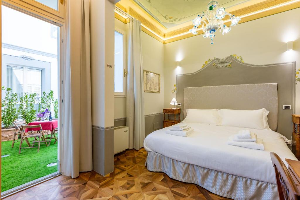 Łóżko lub łóżka w pokoju w obiekcie Villa Tortorelli