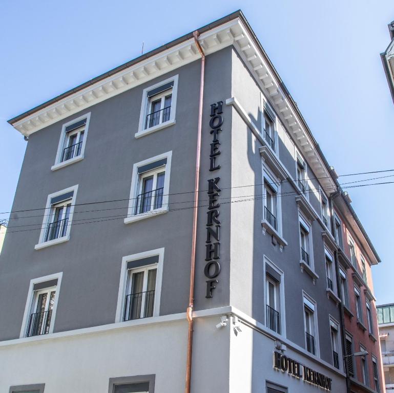 a building with a sign on the side of it at Self Service Hotel Kernhof Langstrasse in Zürich