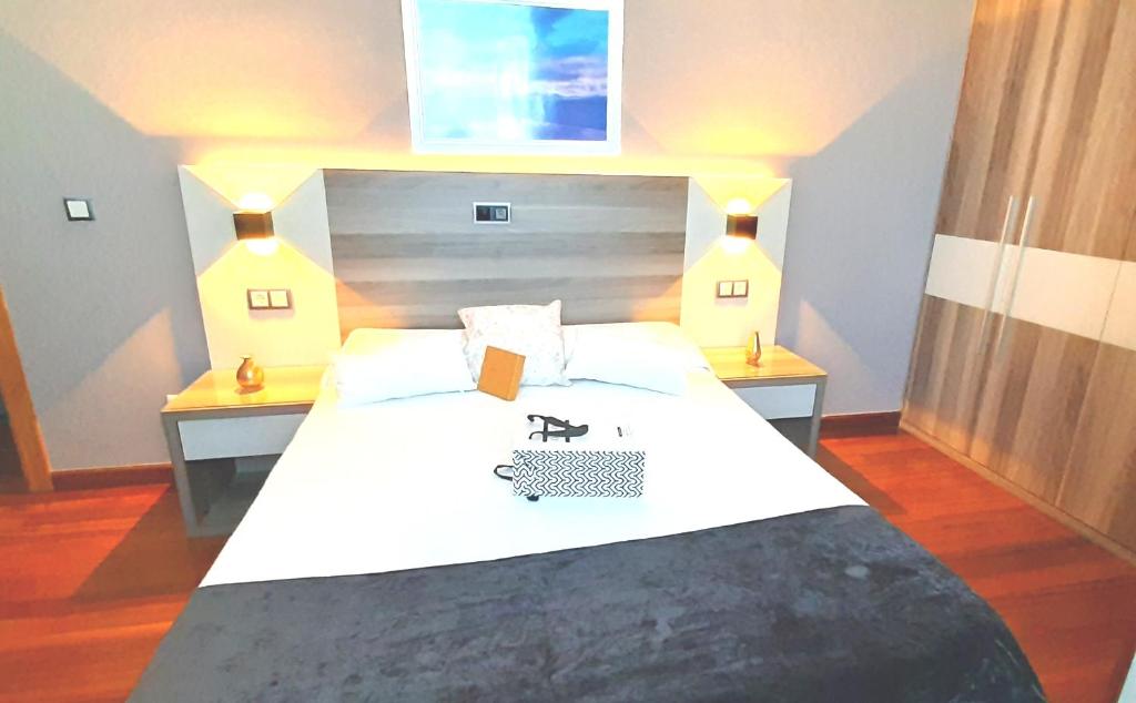 Postel nebo postele na pokoji v ubytování Hotel Nueva Plaza