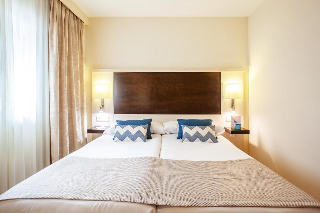 Postel nebo postele na pokoji v ubytování Grupotel Dunamar