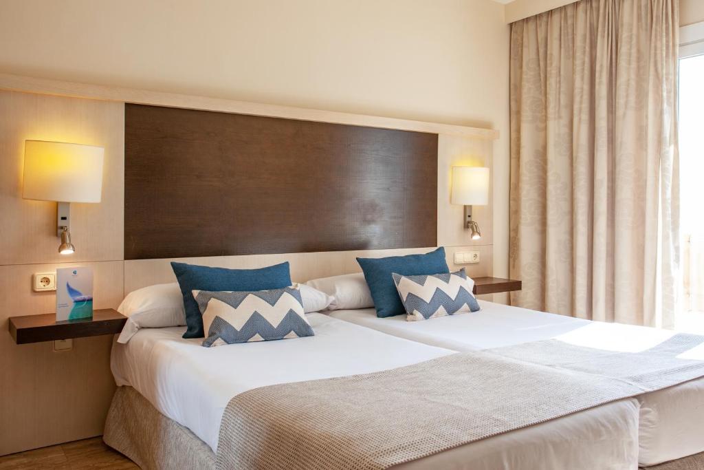 Postel nebo postele na pokoji v ubytování Grupotel Dunamar