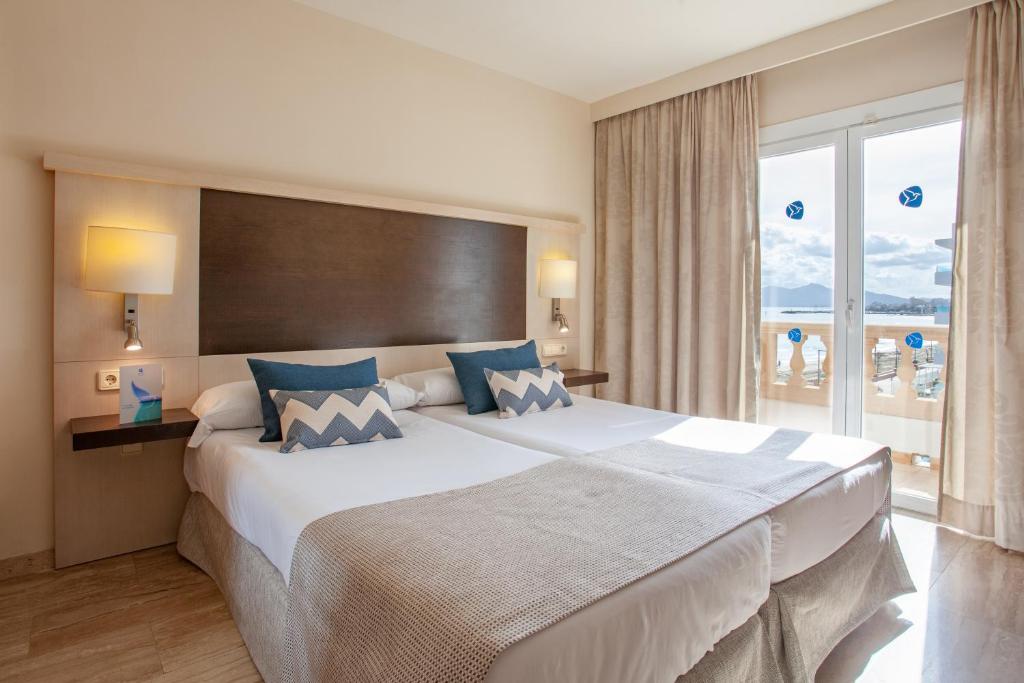 Postel nebo postele na pokoji v ubytování Grupotel Dunamar