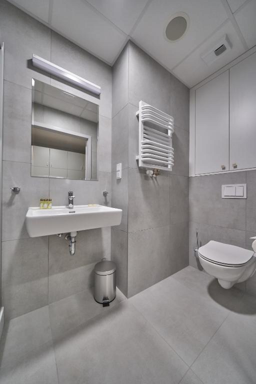 Kúpeľňa v ubytovaní Apartamenty Collegia