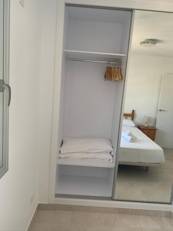 A bed or beds in a room at SERVICE APART LAZARO - Apartamentos Aguamarina 47