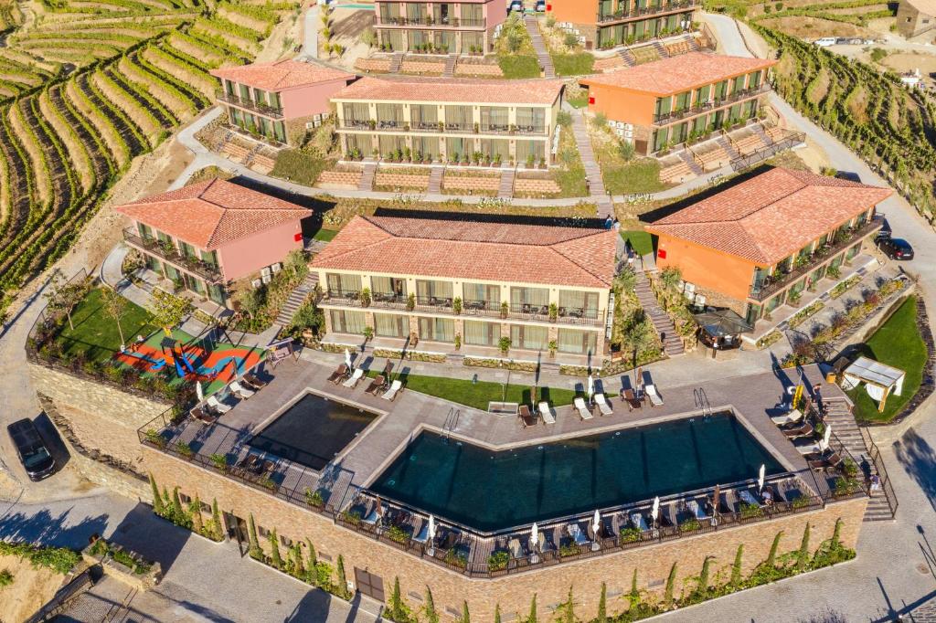 an aerial view of a building with a swimming pool at Vila Gale Douro Vineyards in Armamar