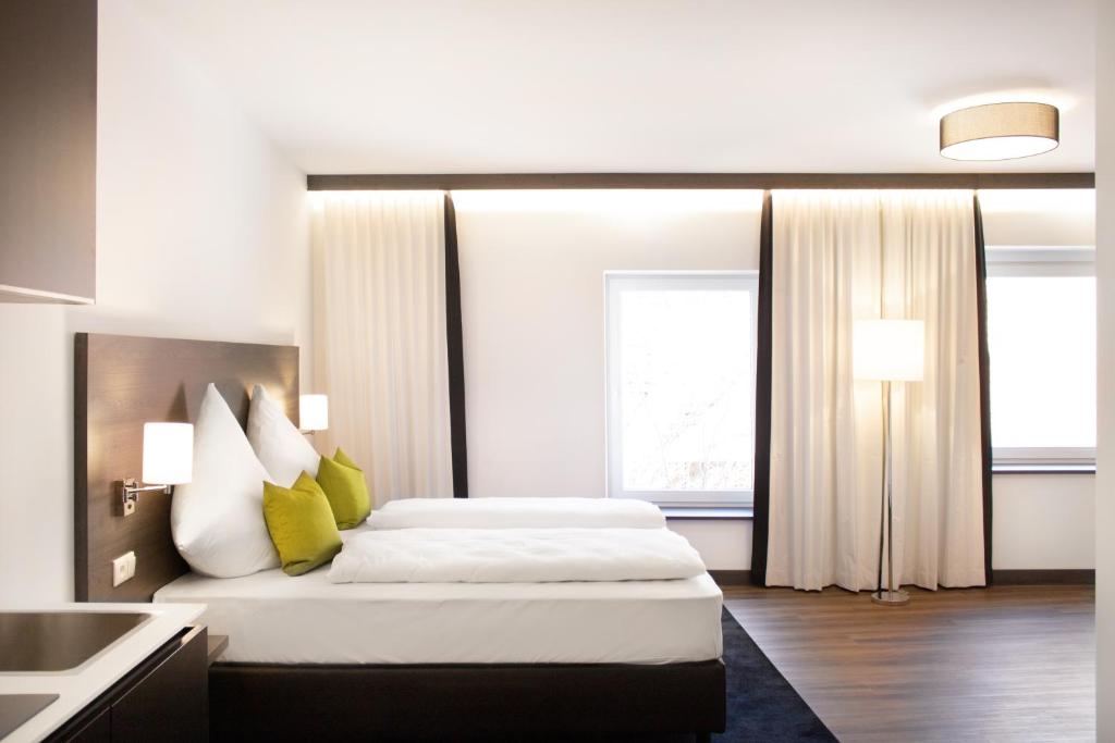 Postel nebo postele na pokoji v ubytování KU Hotel by WMM Hotels