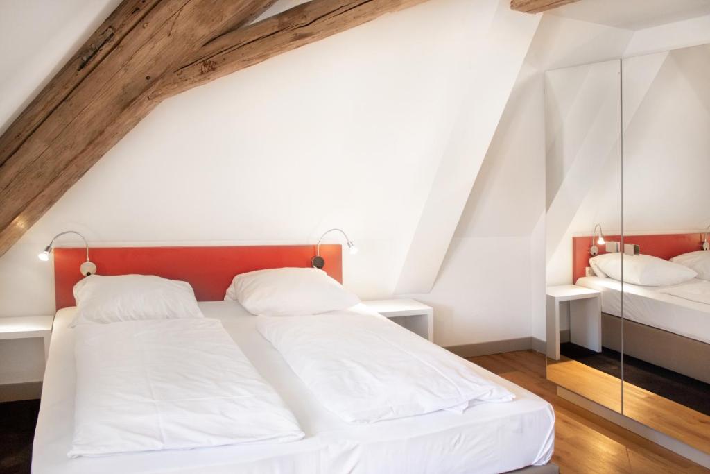 Postel nebo postele na pokoji v ubytování KU Hotel by WMM Hotels