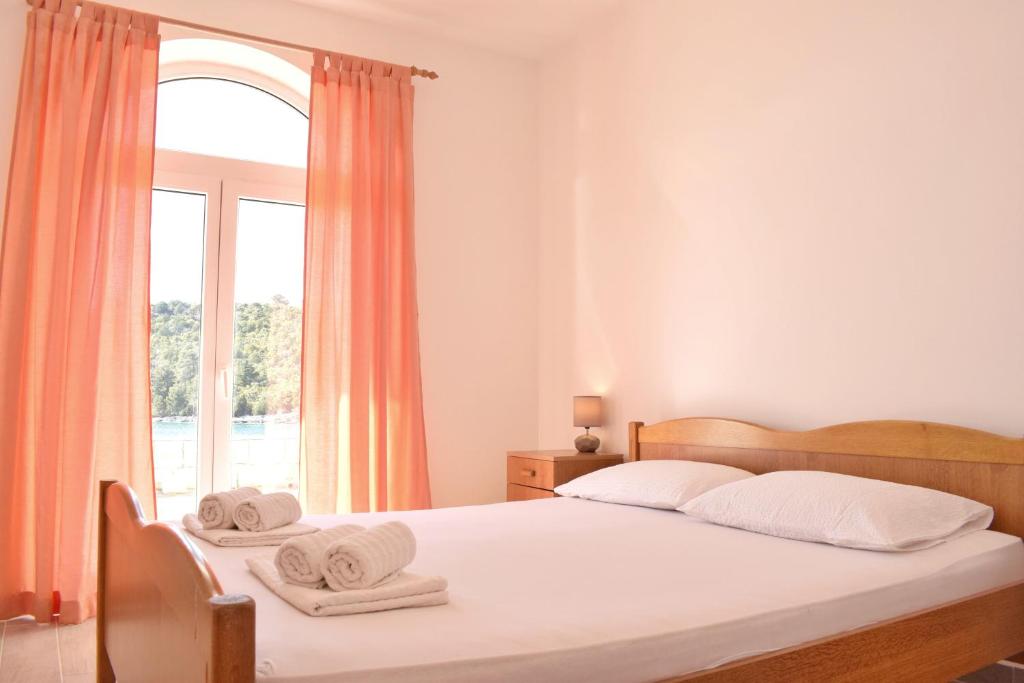 Un ou plusieurs lits dans un hébergement de l'établissement Mljet Sunset Apartments