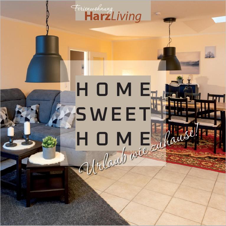 a living room with ahome sweet home sign at Harz Living in Clausthal-Zellerfeld