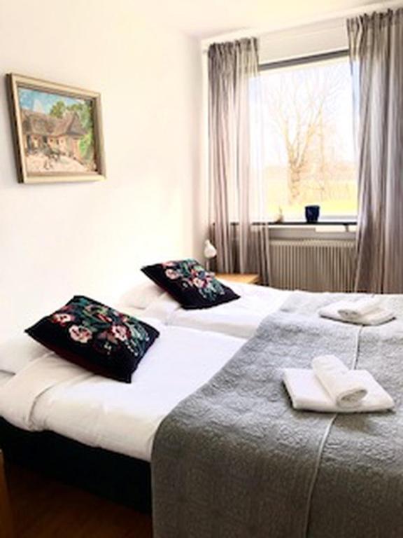 Postel nebo postele na pokoji v ubytování Österlengården