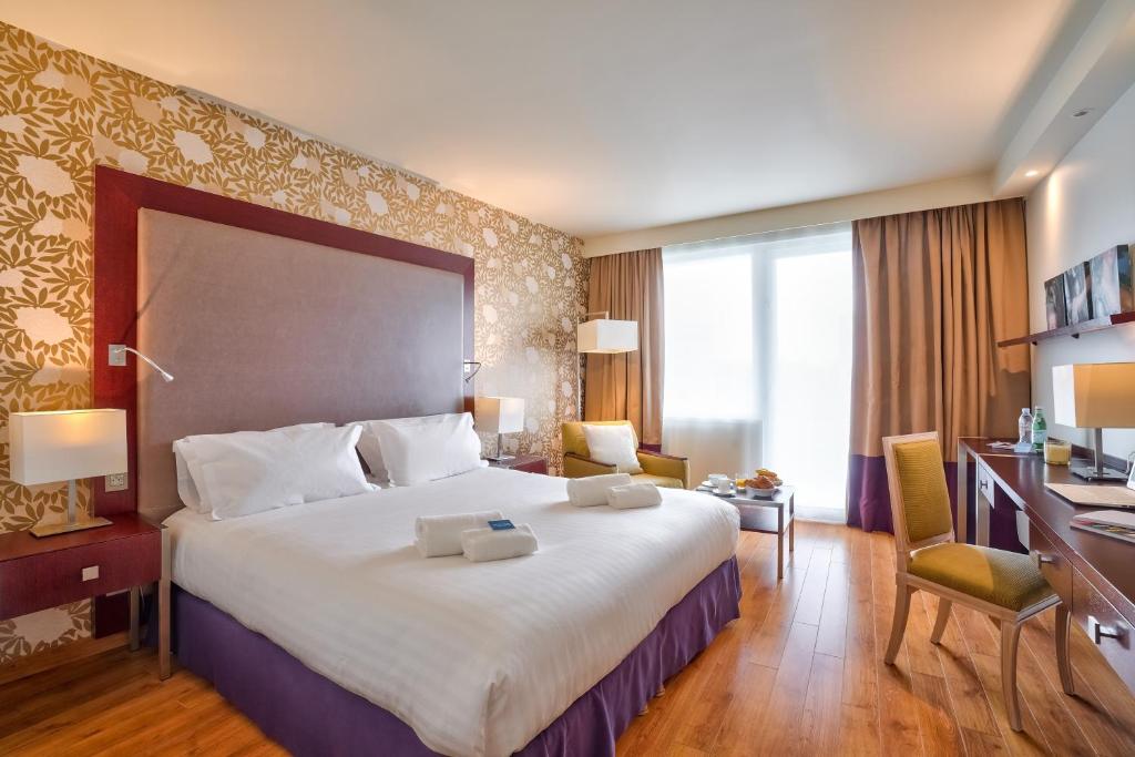 Postel nebo postele na pokoji v ubytování Zenitude Relais & Spa - Paris Charles de Gaulle