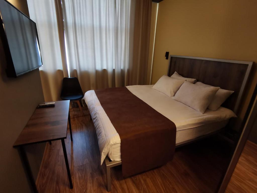 Postel nebo postele na pokoji v ubytování STARK HOTEL