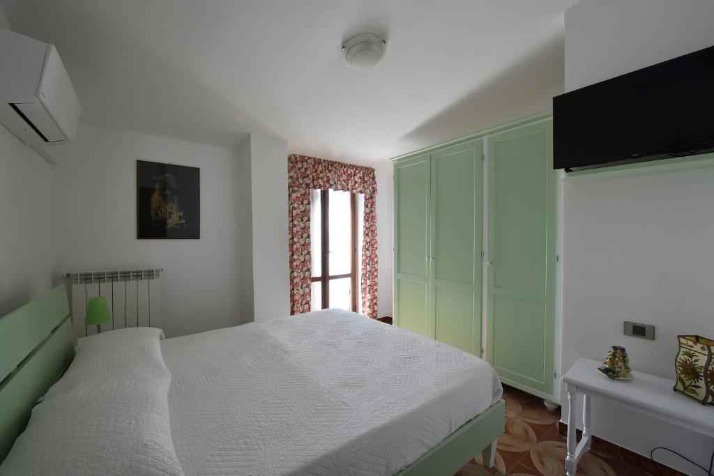 Ένα ή περισσότερα κρεβάτια σε δωμάτιο στο Villa Dafne mare Fondi Sperlonga