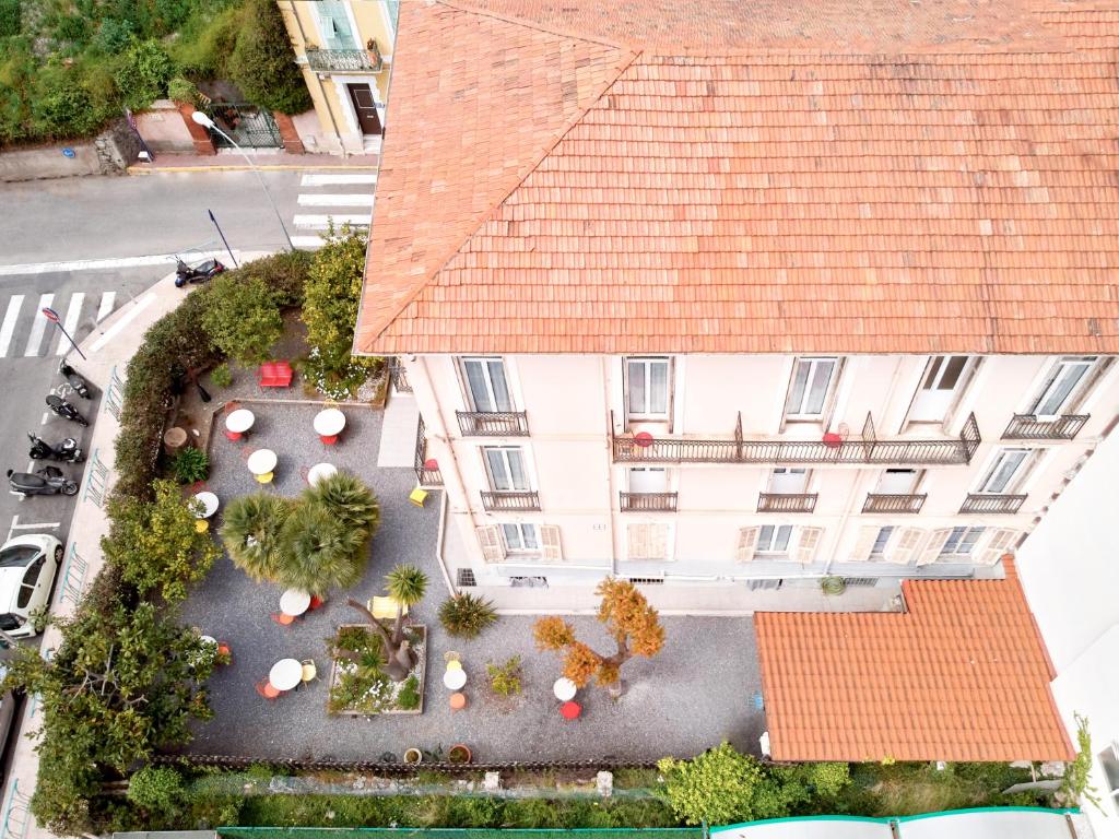 an overhead view of a building with a courtyard at Hotel Lemon in Menton