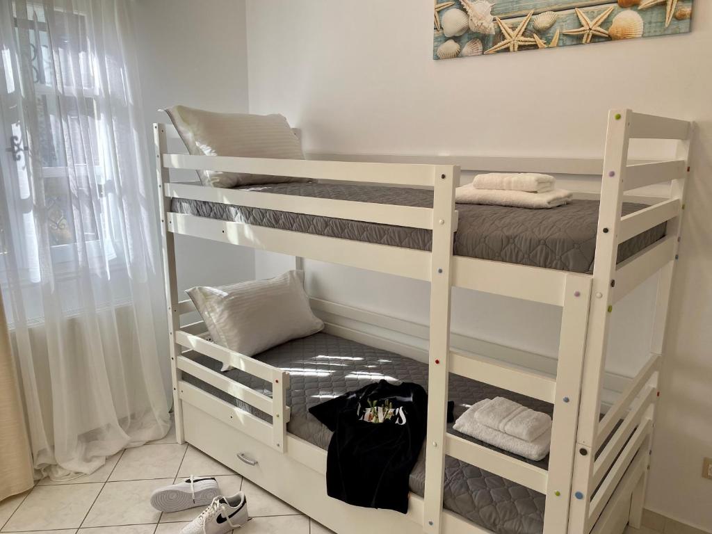 a room with two bunk beds in a room at PORTA HOME modern and hospitable in Naxos Chora