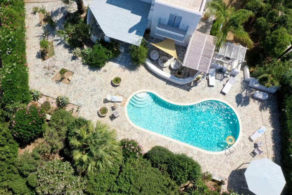 an overhead view of a swimming pool in front of a house at Riviera Paradise : unique vacations experience in Aliko Beach