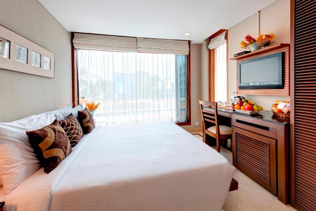 Postel nebo postele na pokoji v ubytování Hotel Casa Fortuna