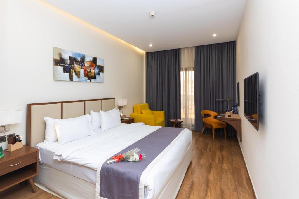 Postel nebo postele na pokoji v ubytování Le Wana Hotel