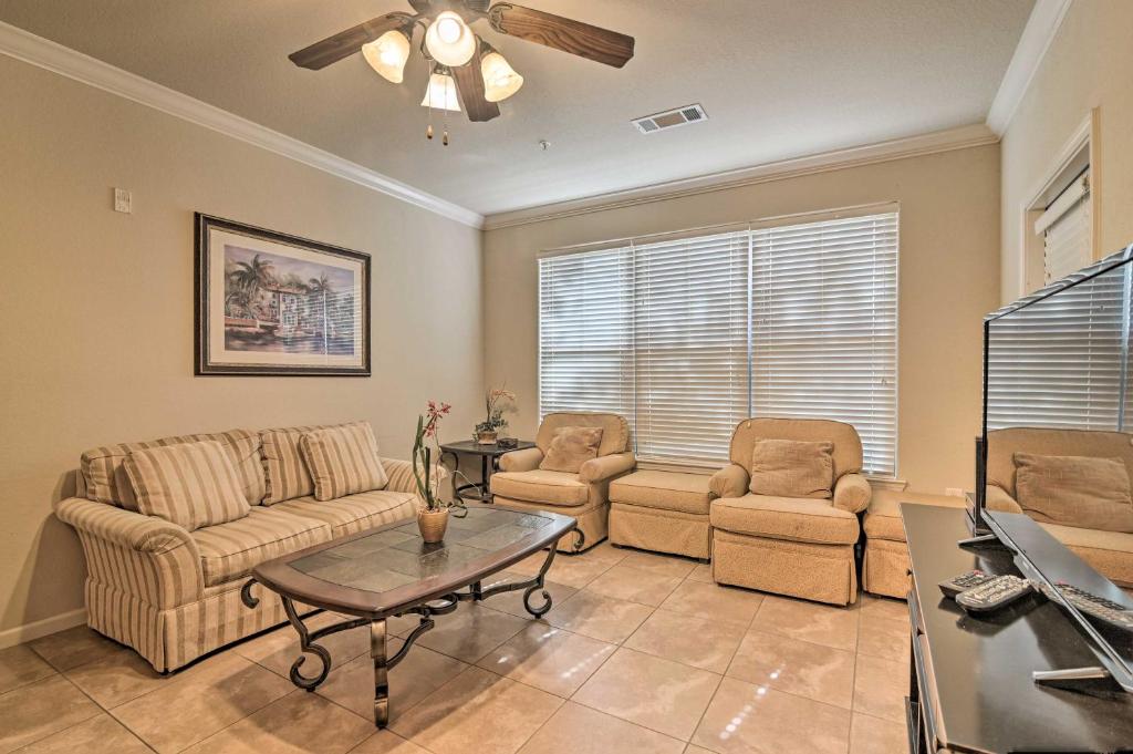 a living room with a couch and two chairs and a table at Davenport Condo with Pool Access - 11 Mi to Disney! in Davenport