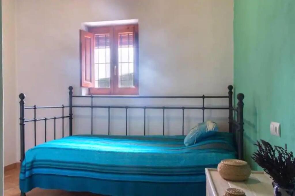 A bed or beds in a room at CASA IBICENCA EN CALA D´HORT