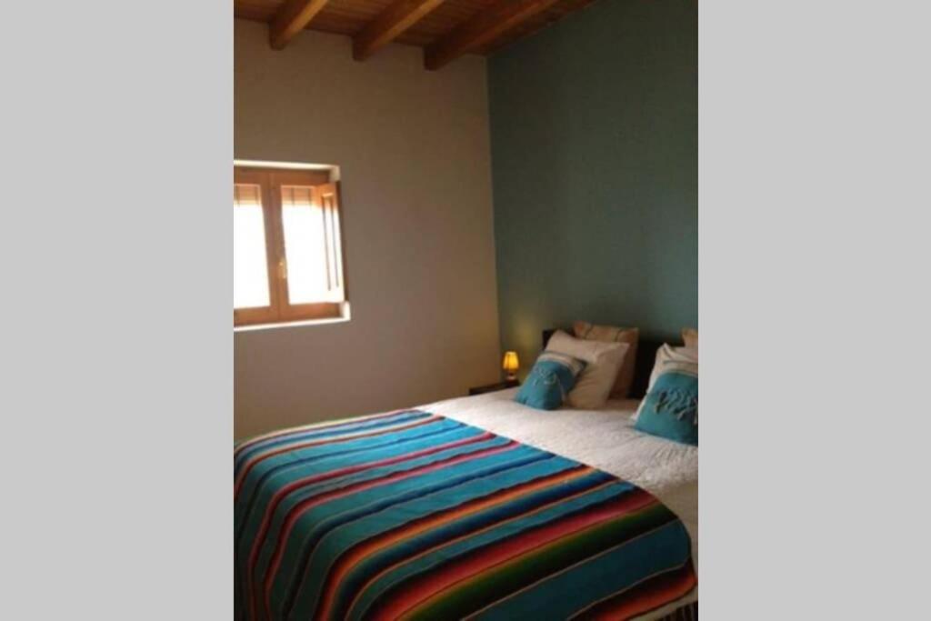 A bed or beds in a room at CASA IBICENCA EN CALA D´HORT