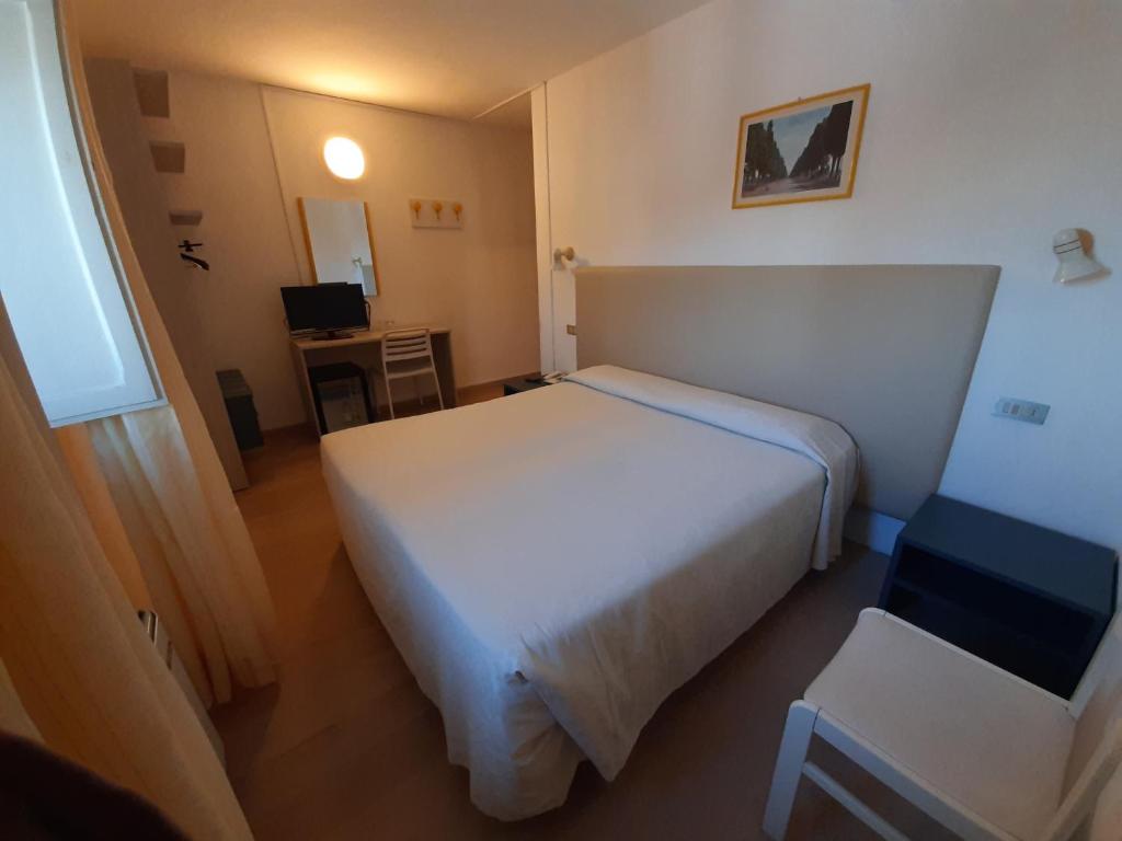 Postel nebo postele na pokoji v ubytování Elba Hotel