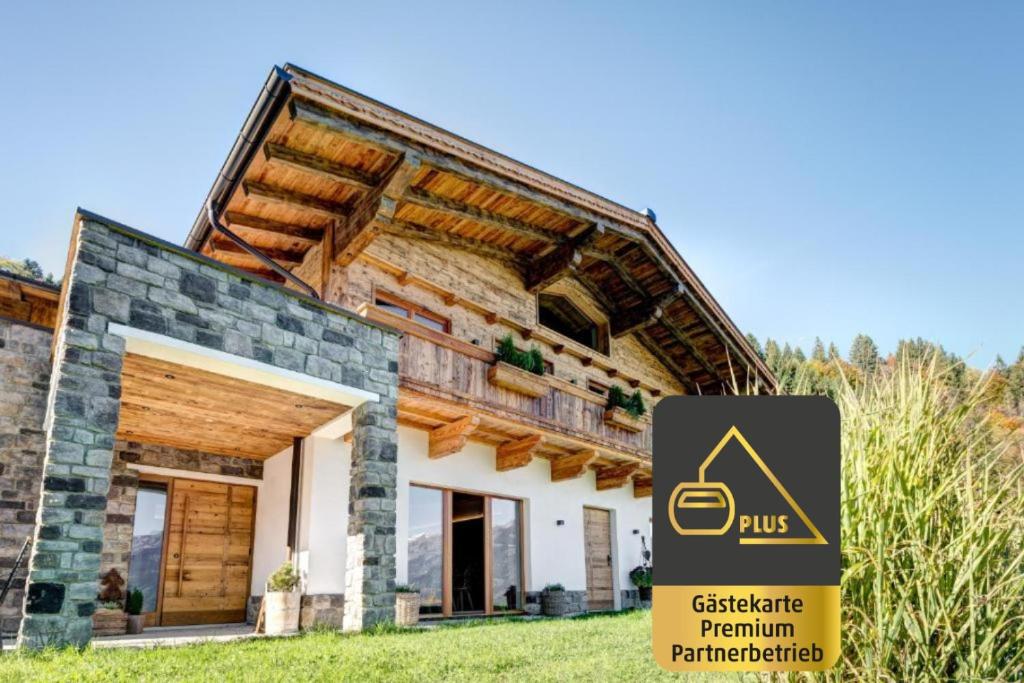 a house with a sign in front of it at Rufana Lodge in Bürserberg