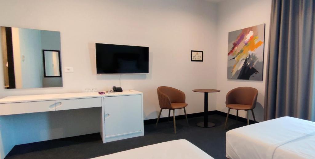 TV a/nebo společenská místnost v ubytování Hotel Delta Premium