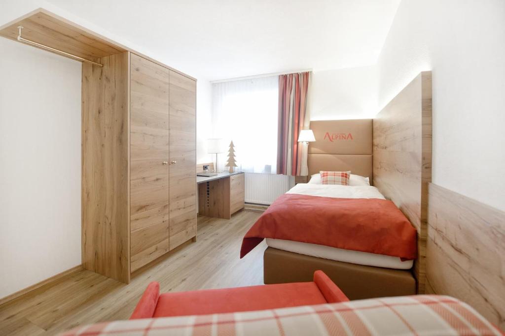 Postel nebo postele na pokoji v ubytování Hotel Alpina Superior