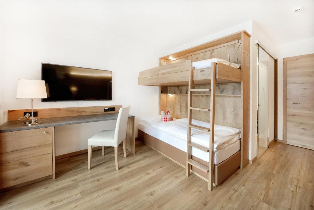 Postel nebo postele na pokoji v ubytování Hotel Alpina Superior
