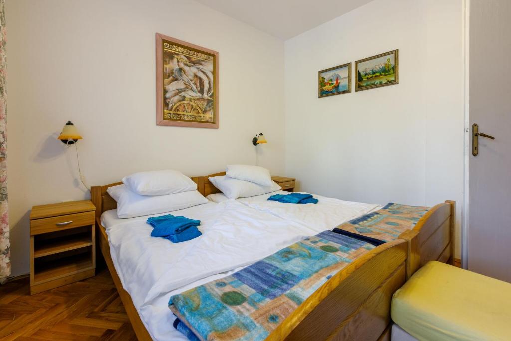 Postel nebo postele na pokoji v ubytování Apartments Villa 7