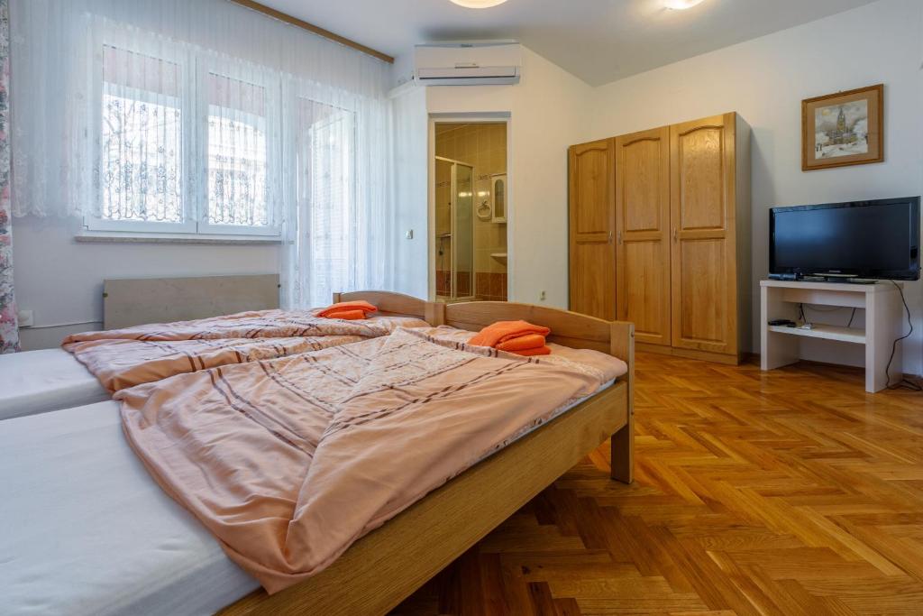 Postel nebo postele na pokoji v ubytování Apartments Villa 7