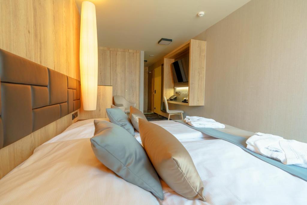Postel nebo postele na pokoji v ubytování Hotel Hills