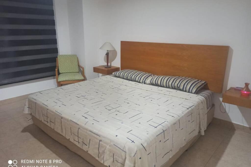 Cama o camas de una habitación en MANTA BEACH HOGAR DULCE HOGAR