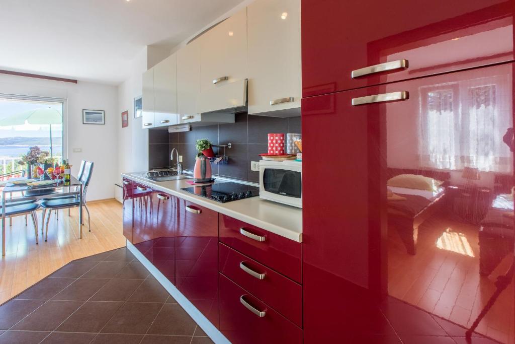Kuchyň nebo kuchyňský kout v ubytování Apartments Robic