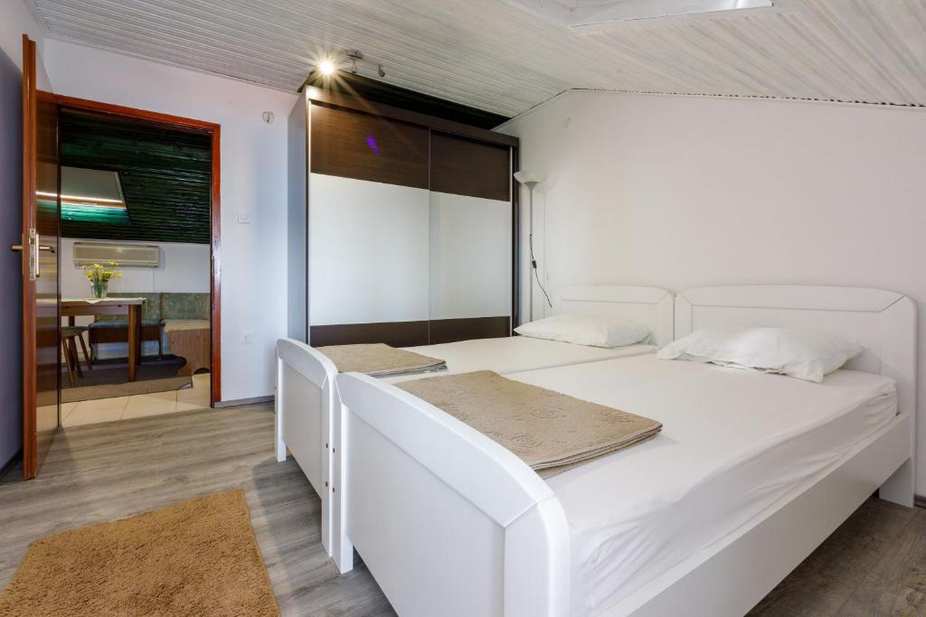 Postel nebo postele na pokoji v ubytování Apartment Heriban