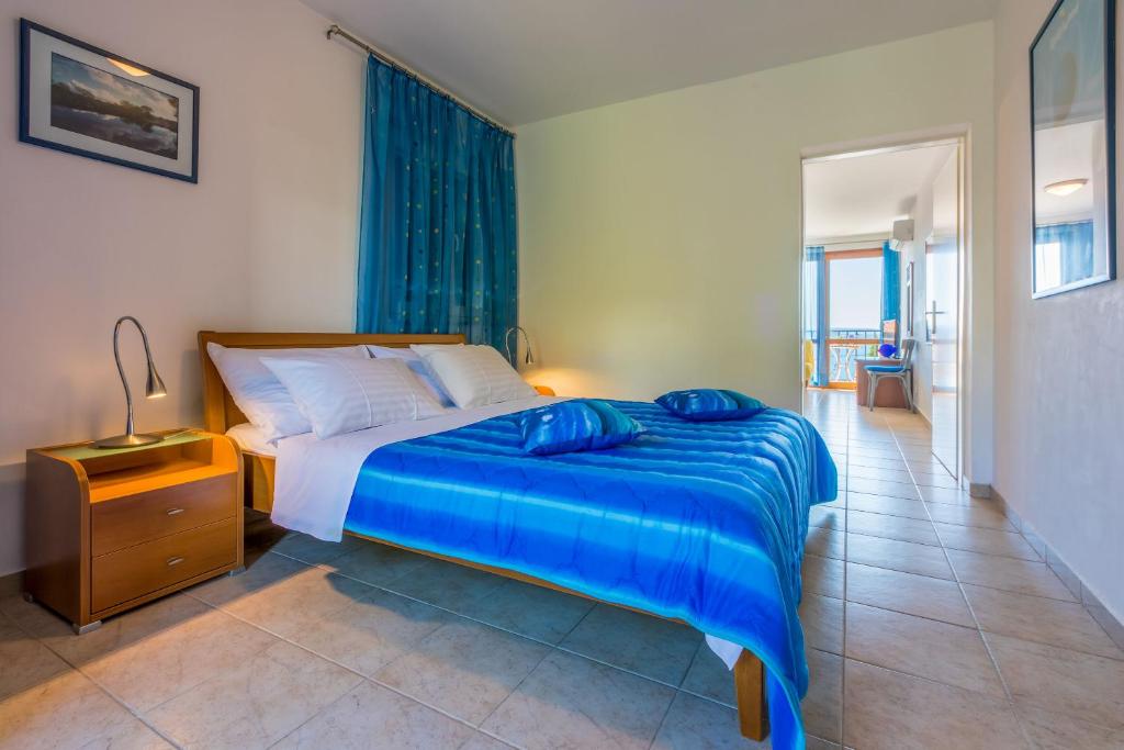 Posteľ alebo postele v izbe v ubytovaní Apartments Loncaric
