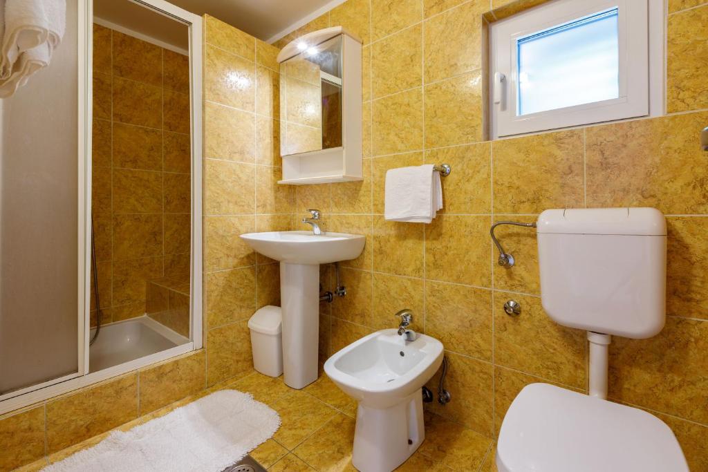 Kúpeľňa v ubytovaní Apartments Loncaric