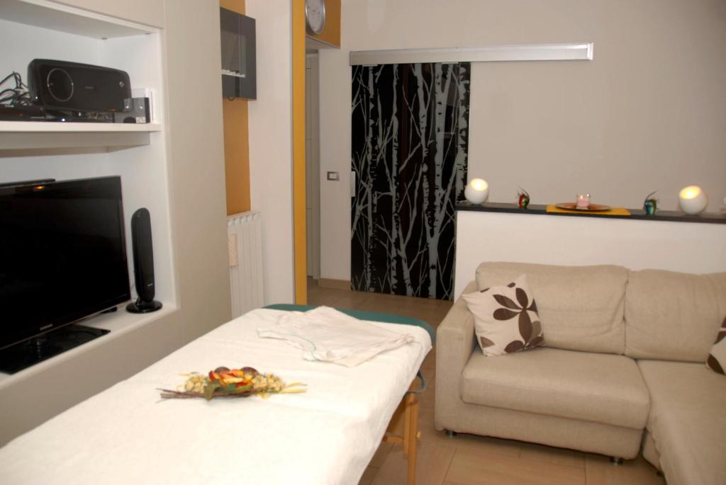 TV a/nebo společenská místnost v ubytování I Coralli rooms & apartments