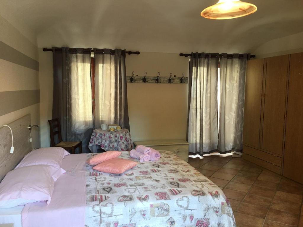 Postel nebo postele na pokoji v ubytování B&B sotto le mura