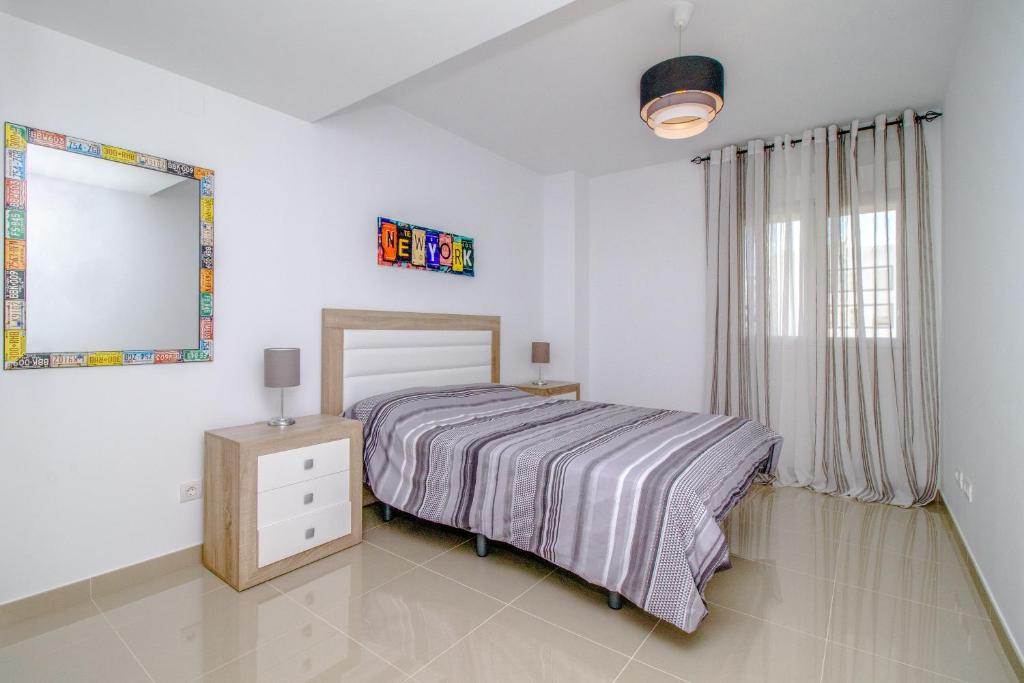 Ένα ή περισσότερα κρεβάτια σε δωμάτιο στο Flamenco beach house