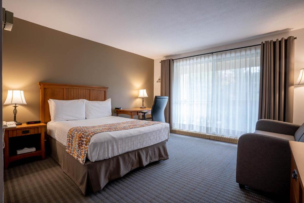 Postel nebo postele na pokoji v ubytování Hôtel Chéribourg