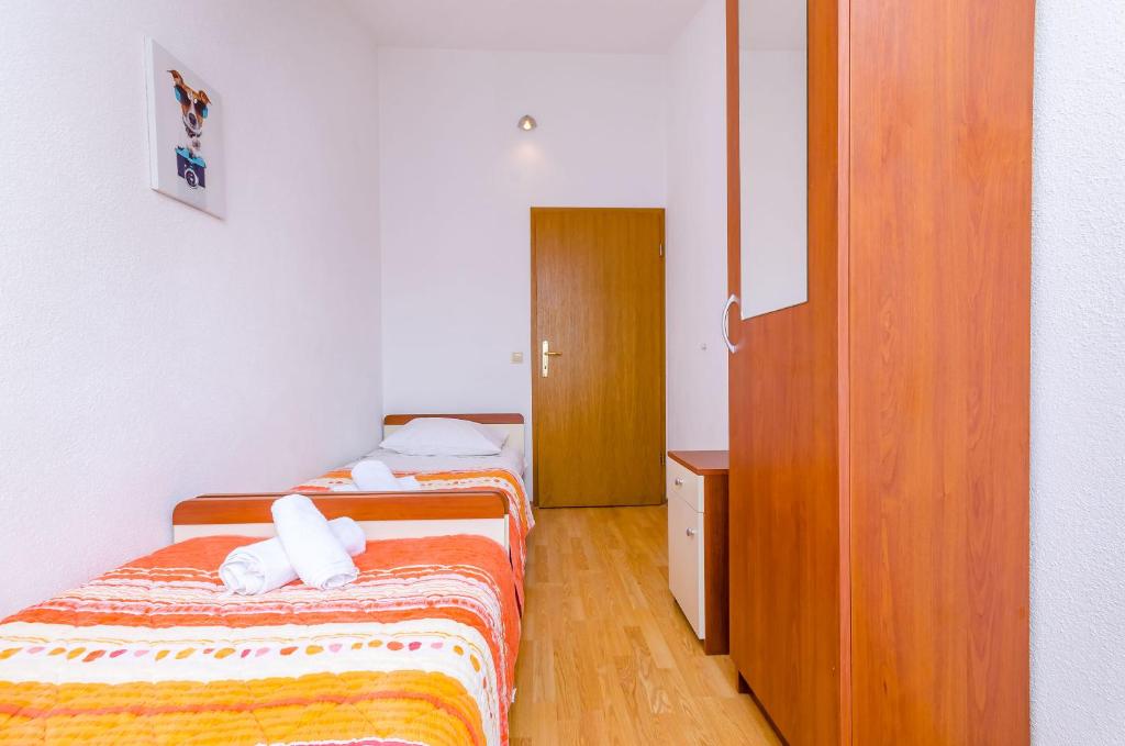 Postel nebo postele na pokoji v ubytování Apartments Tily